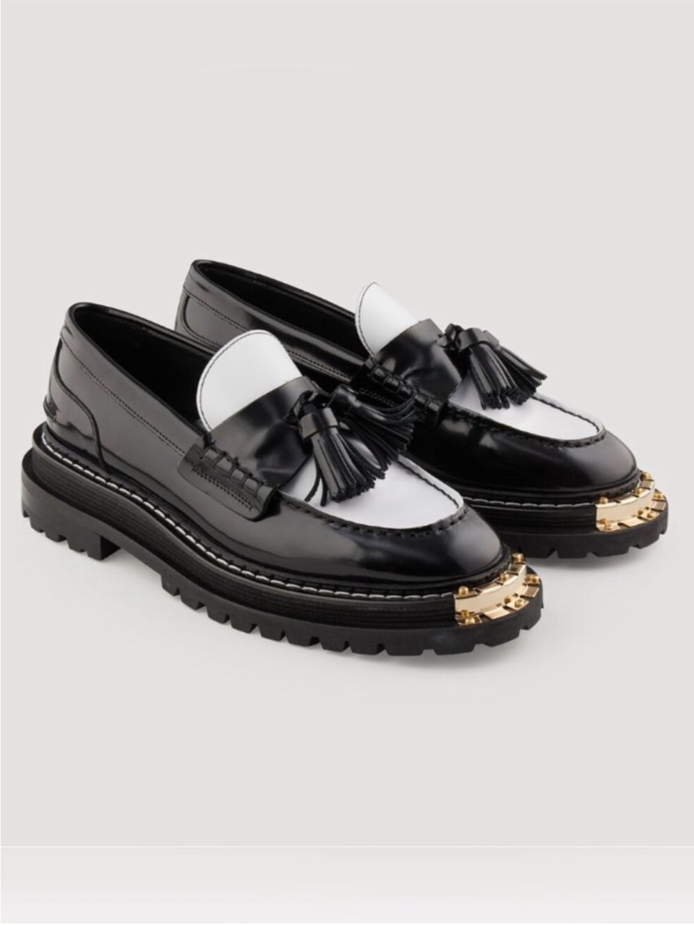 Sandro Black and White Tassel Lug Sole Loafers with Gold Toe Accent